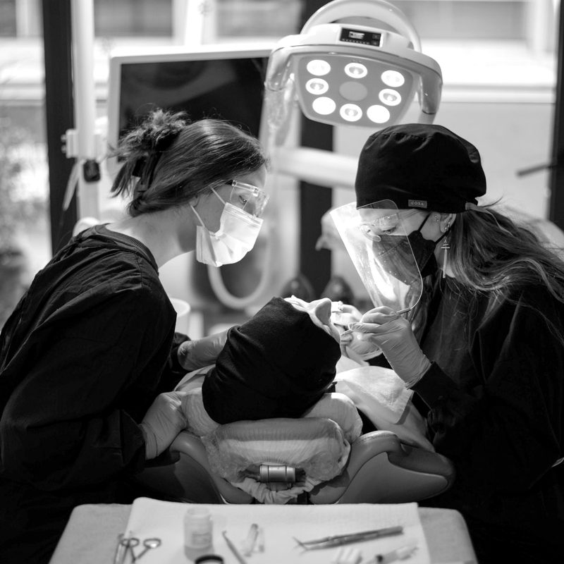 Dentists treating a patient